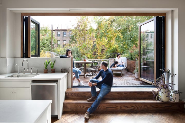NanaWall folding glass wall opened to a patio