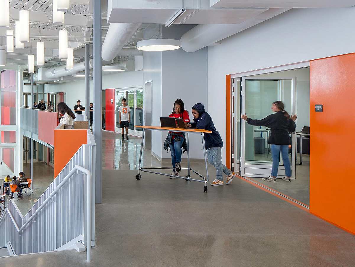 student opporating folding door in one of the  21st century classrooms at rio del sol academy