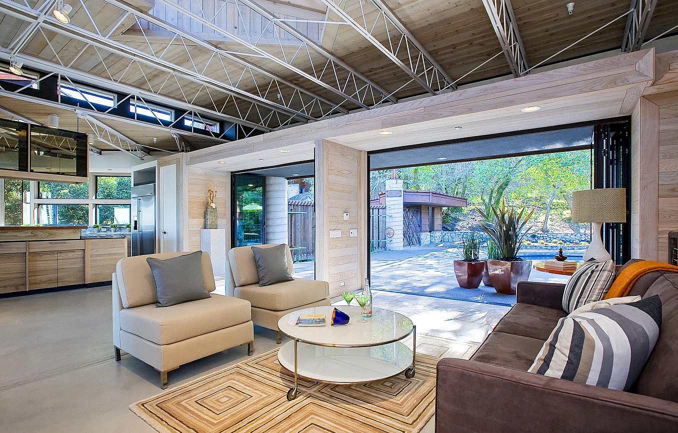 Living room remodel inspiration with opening glass wall