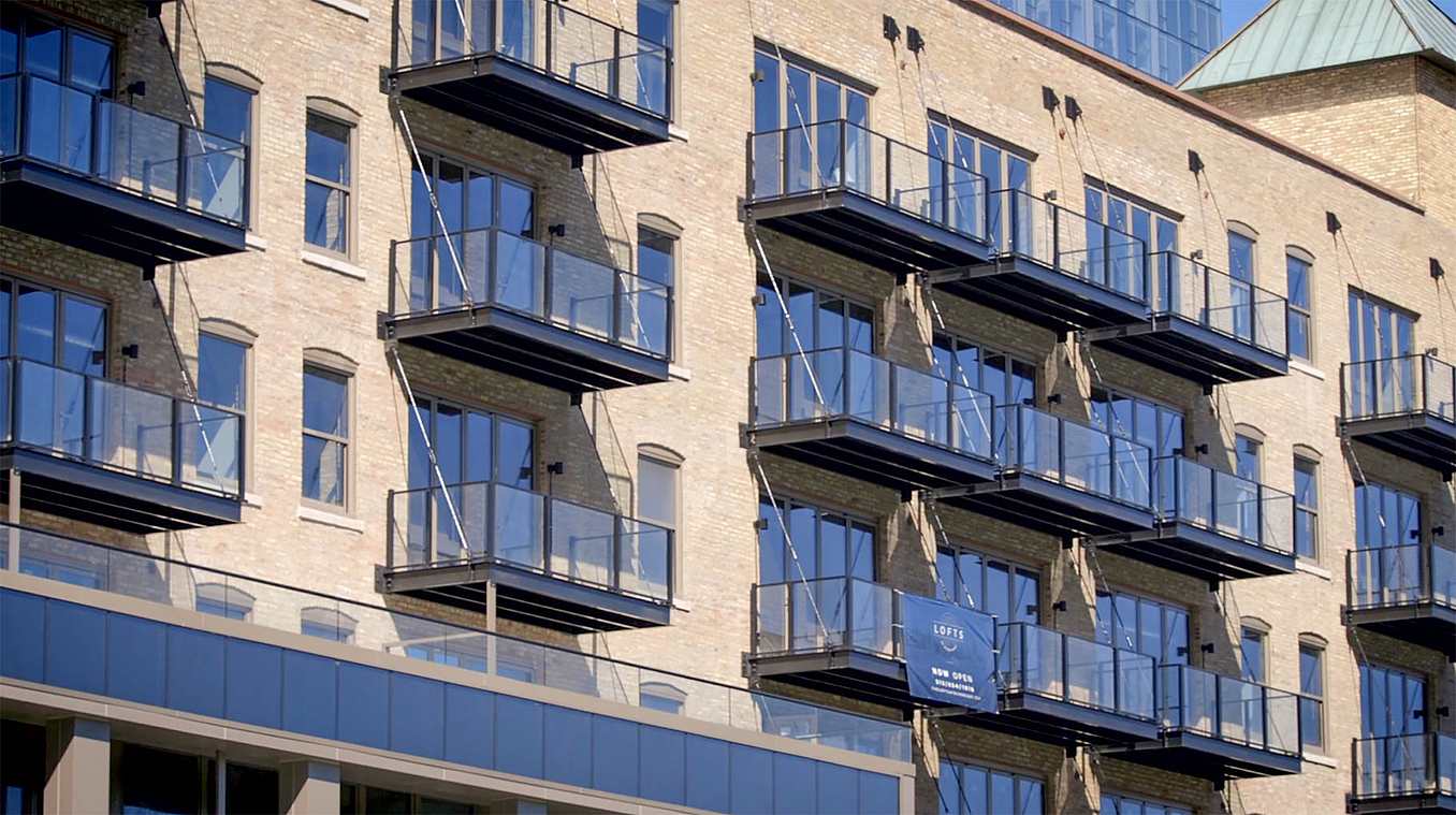 multifamily balcony design with NanaWall folding glass walls