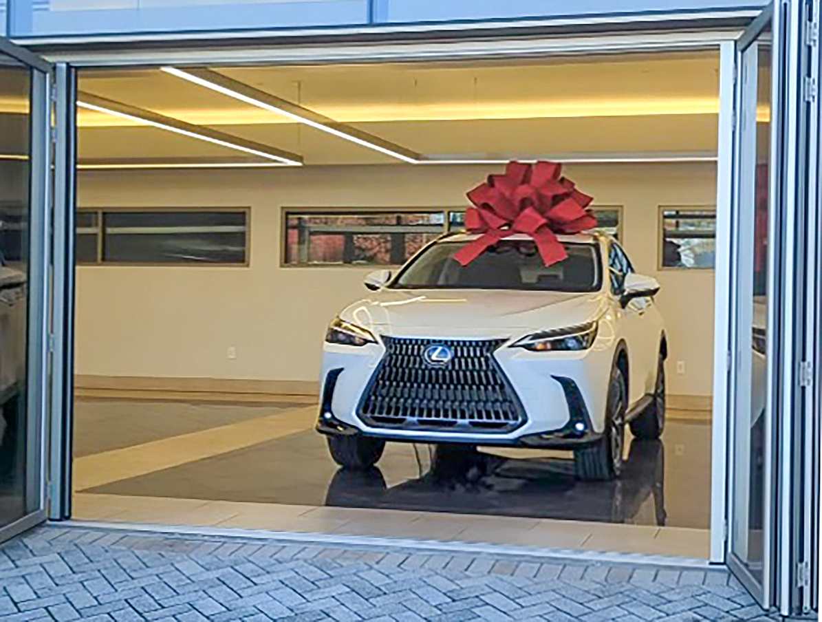 Lexus drive off experience with commercial opening glass door