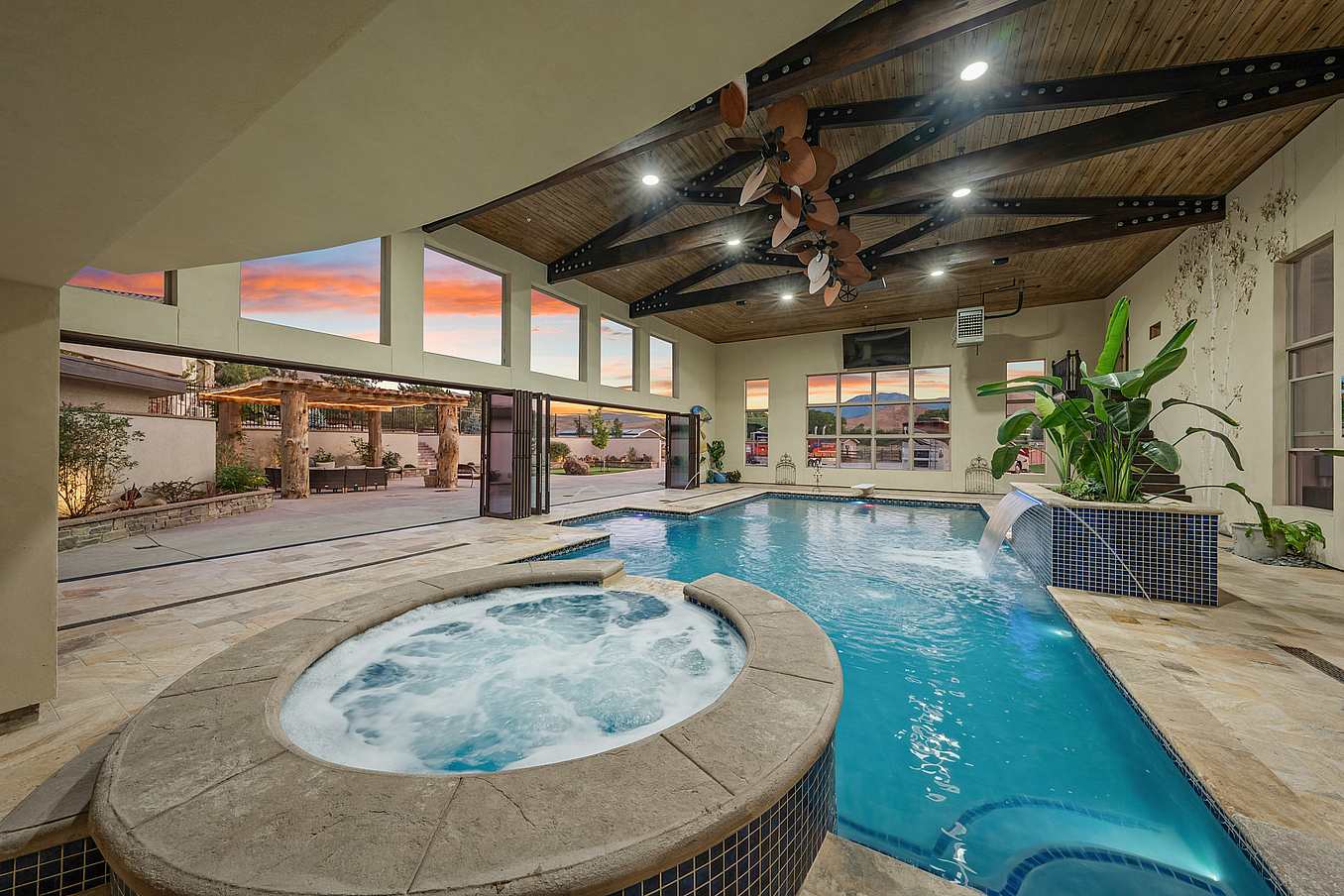 Pool-pavillion with movable glass doors