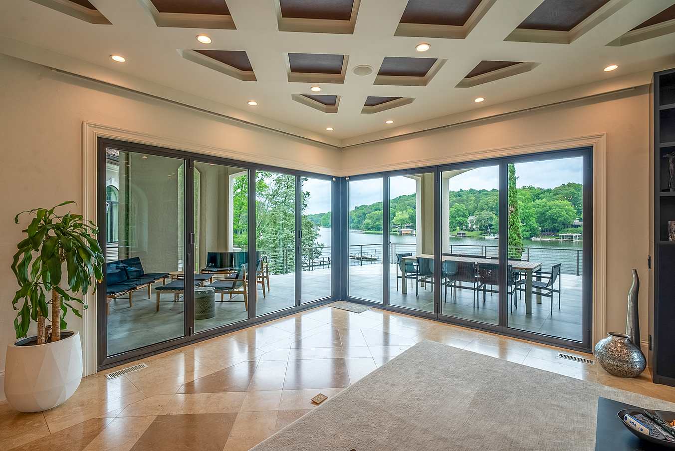 indoor-outdoor waterfront living with folding glass doors
