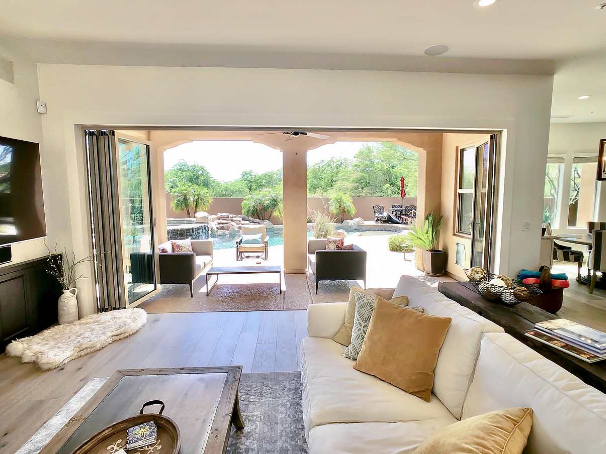view out of remodeled family room through a folding glass wall