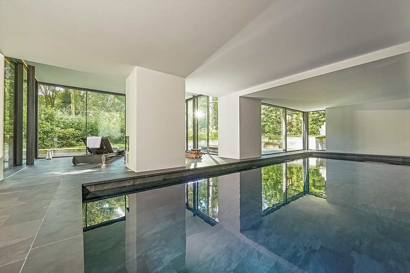 floor to ceiling cero minimal sliding glass walls in pool house
