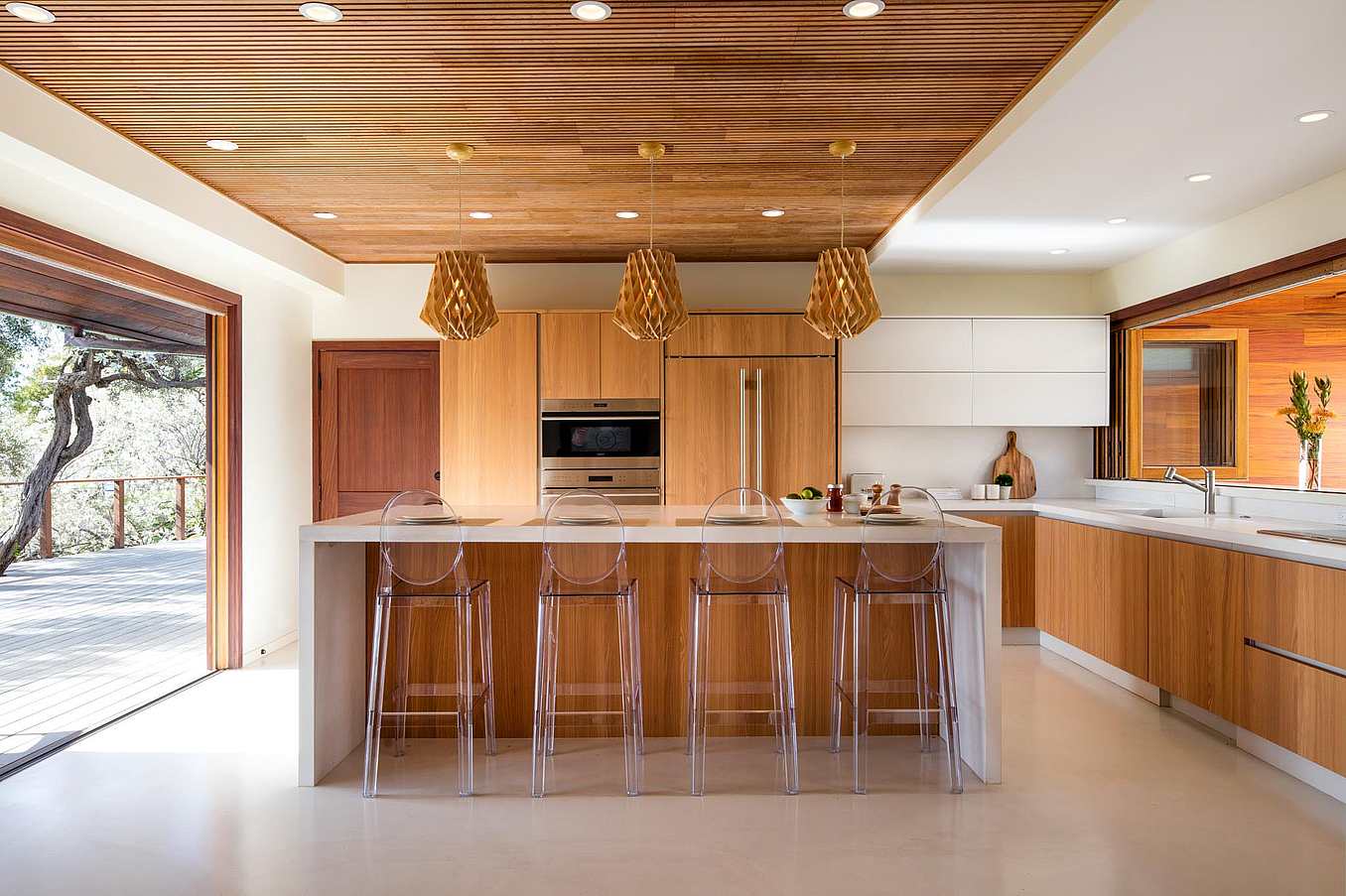 indoor/outdoor kitchen with two wood folding glass walls