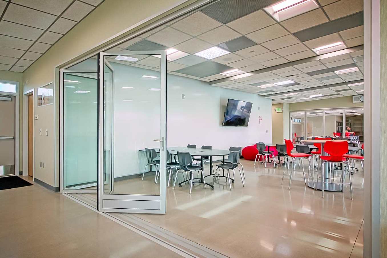 21st Century learning environment with folding glass bifold door for flexible curriculums