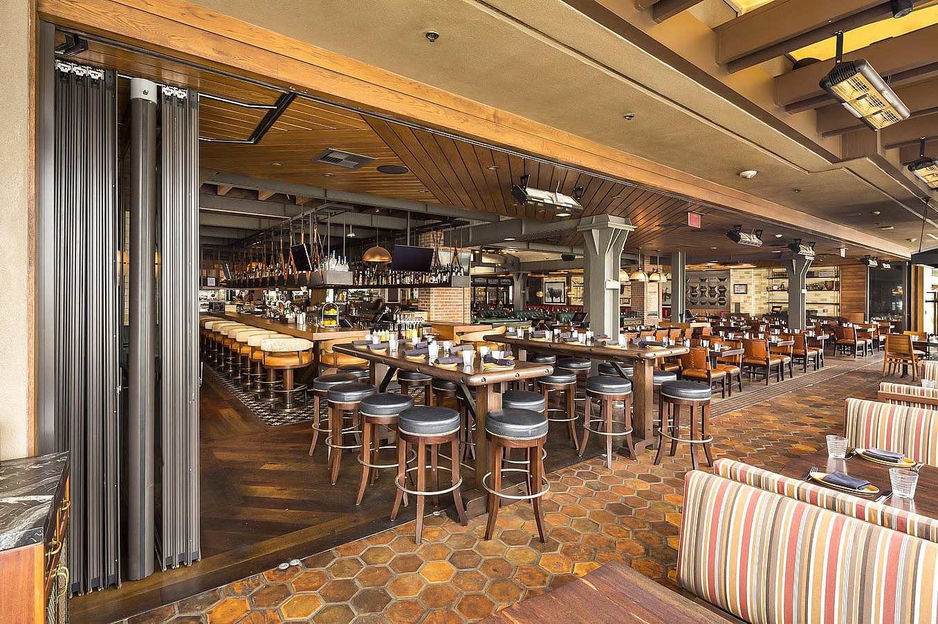 expanded seating with open restaurant design with commercial moving glass walls