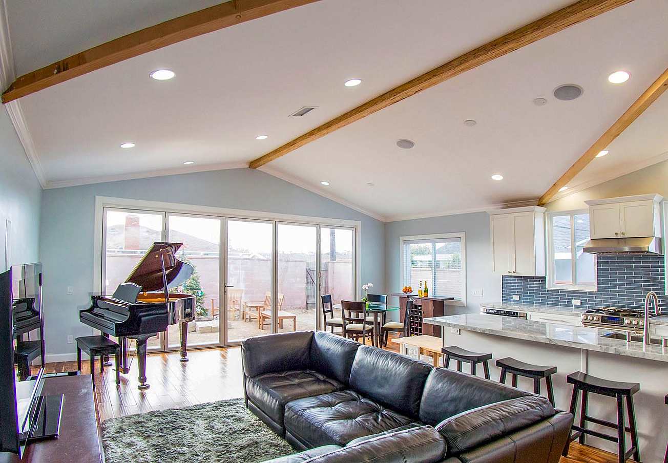 indoor/outdoor living space with operable glass wall