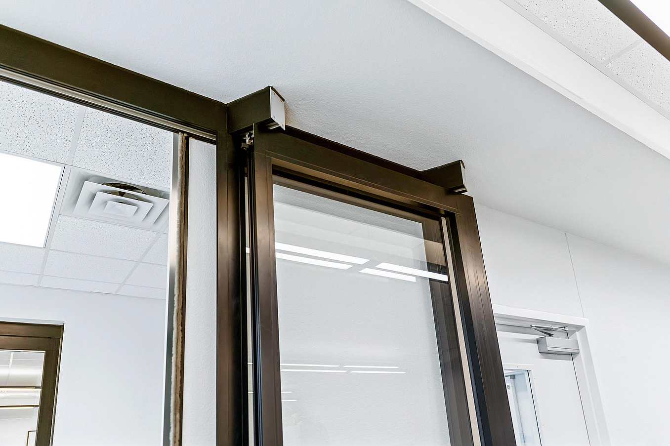 NanaWall HSW stacking glass doors park remotely in learning hub design