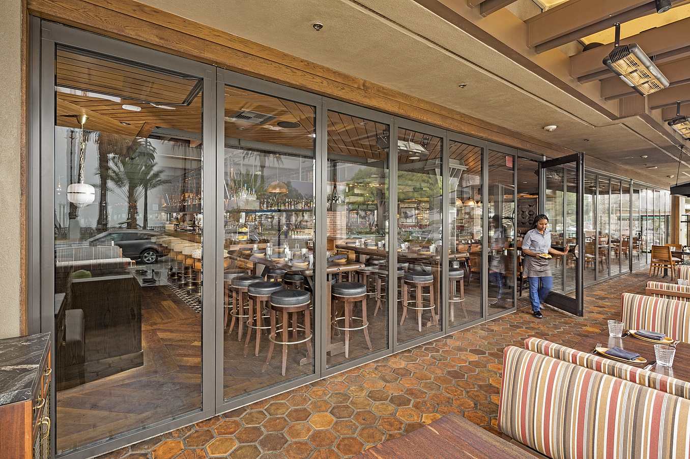 integrated swing door in stacking glass door system for easy access