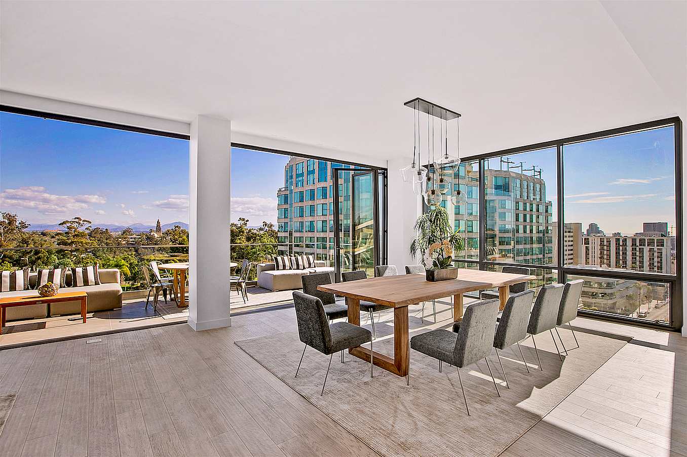 moveable glass wall systems open onto multifamily balcony