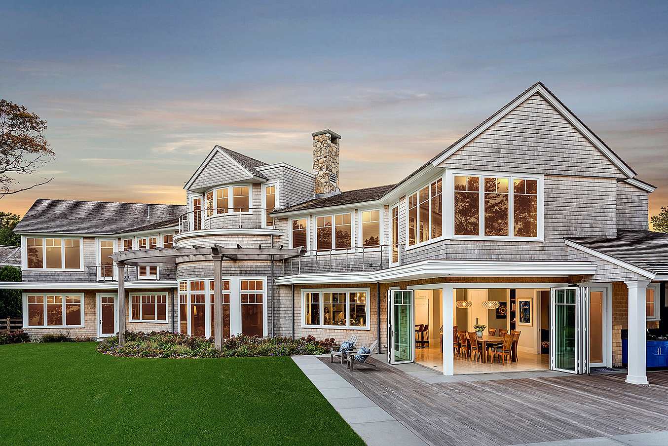 traditional home with aluminum bifolding doors