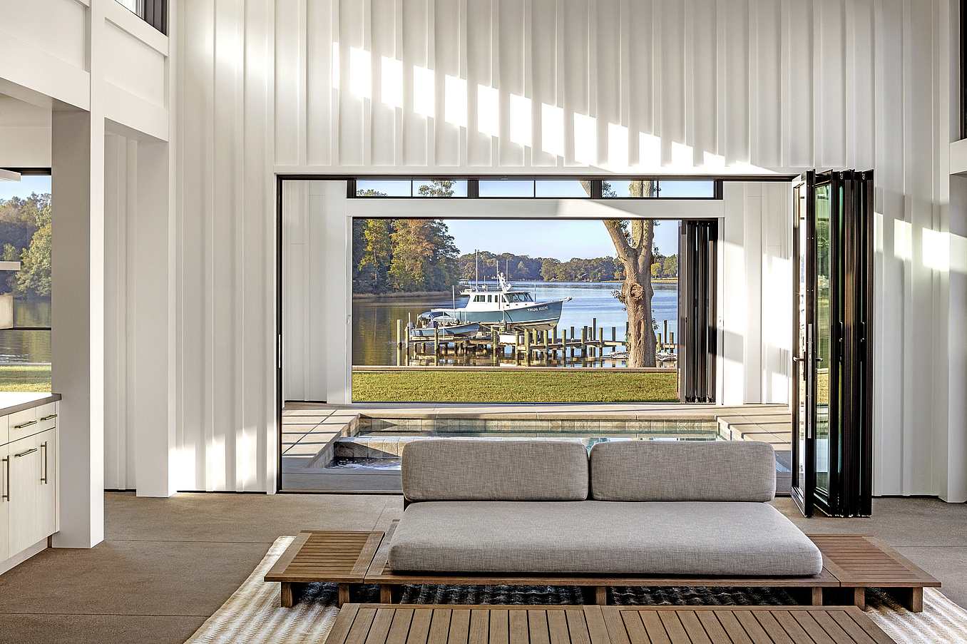 indoor outdoor pool with NanaWall aluminum framed folding doors