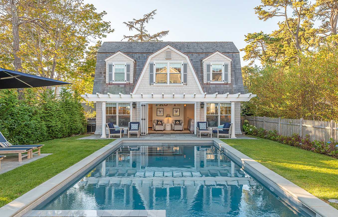 pool house design with clad folding glass walls