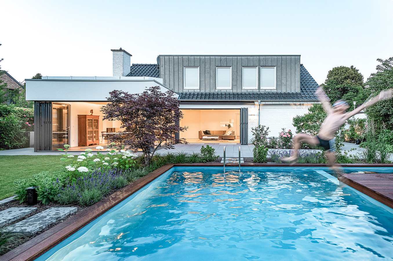 comtemporary home design with exterior opening glass walls