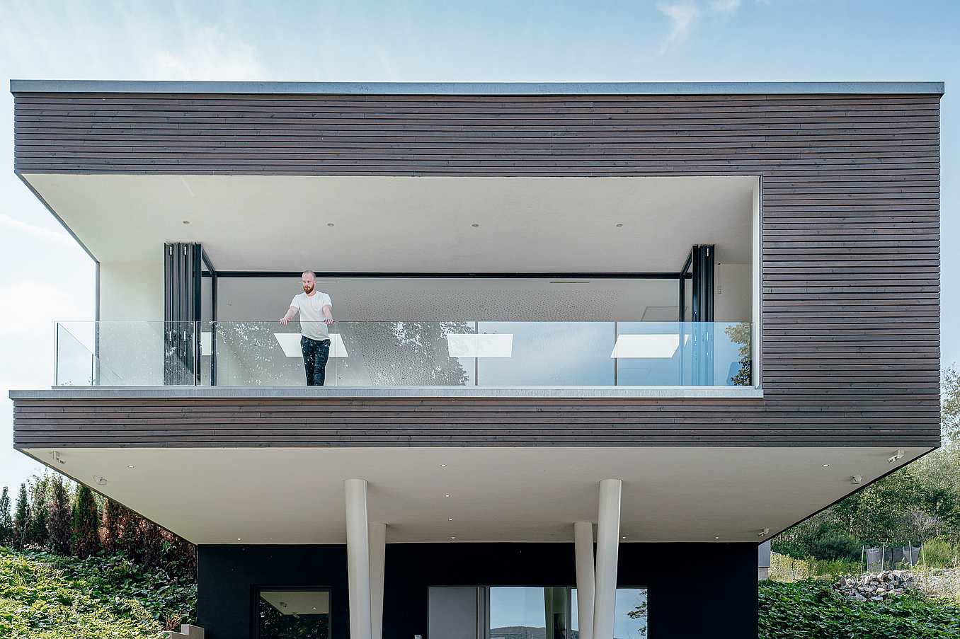 contemporary home with retractable glass walls