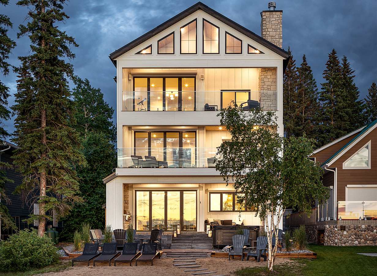 lakefront home design with NanaWall glass walls
