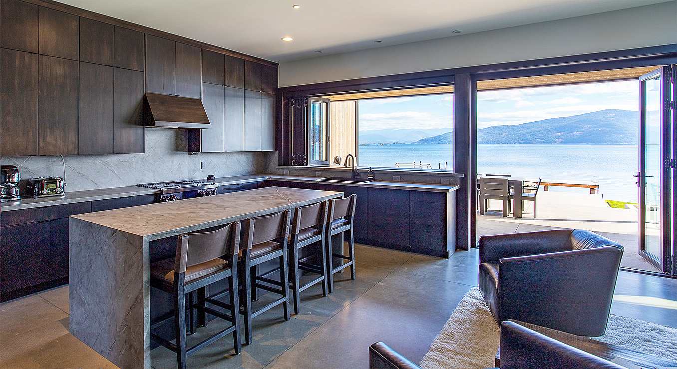 folding glass wall systems in lake home