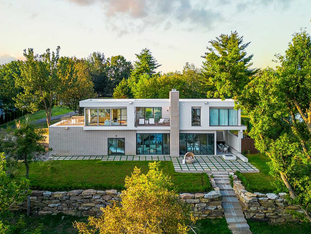 Lakefront home with glass wall systems
