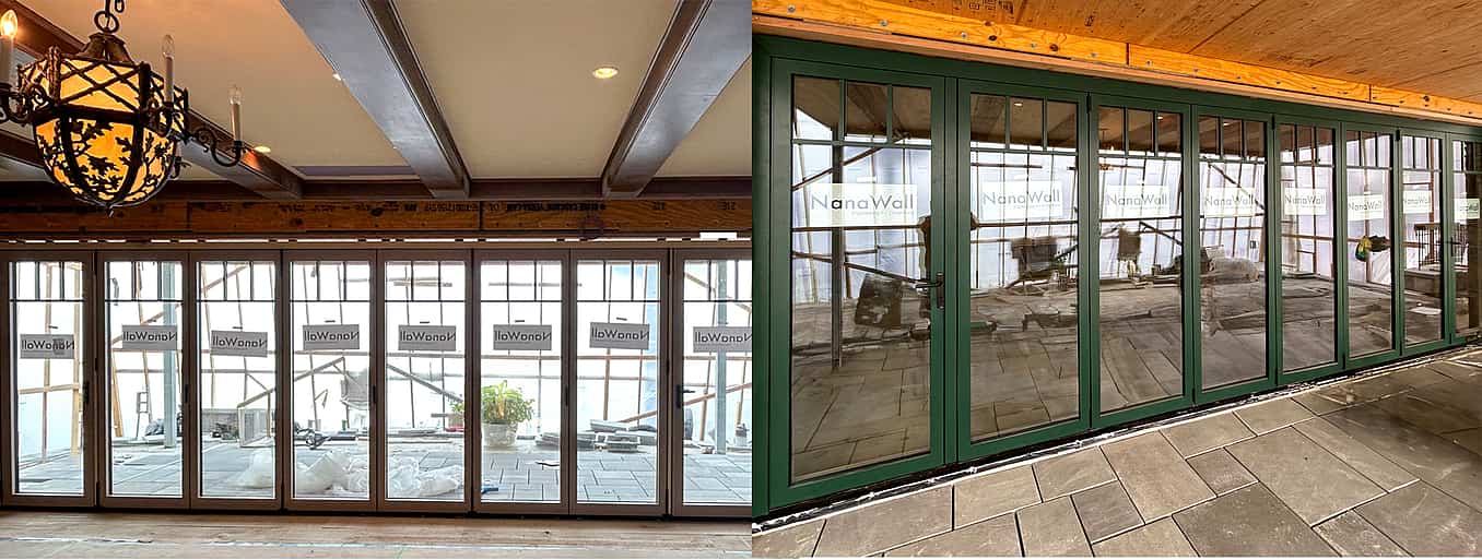 Large set of floor-to-ceiling folding glass doors finished in a dark green powder-coated exterior and rich wood interior.
