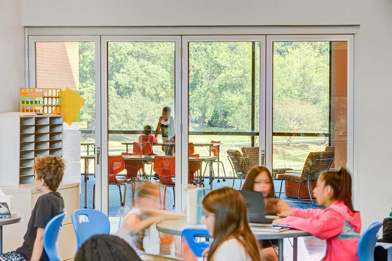 bifold glass wall system in active classroom