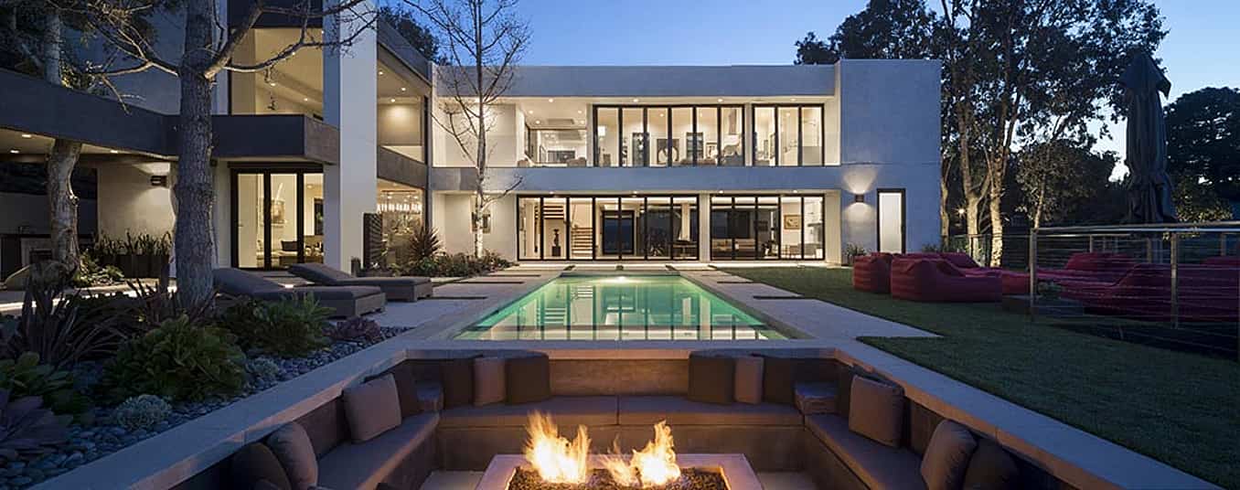 large-residence-built-with-wall-to-wall-opening-glass-walls