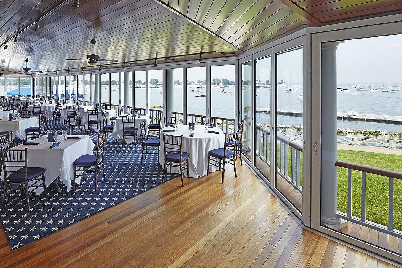 view-of-water-through-opening-glass-walls