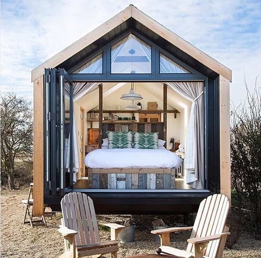 Tiny home in England using large sliding glass doors 