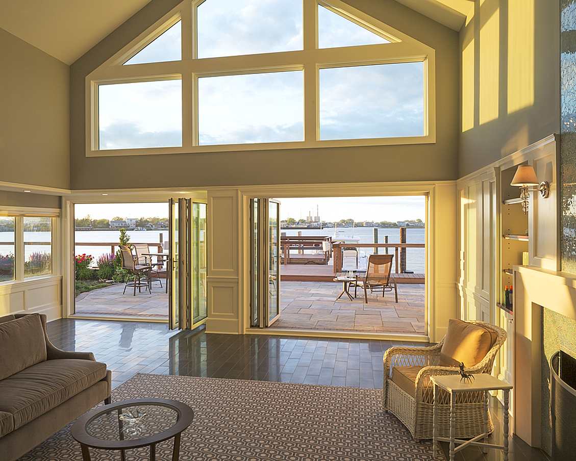 hurricane-rated opening glass door system in resilient home design