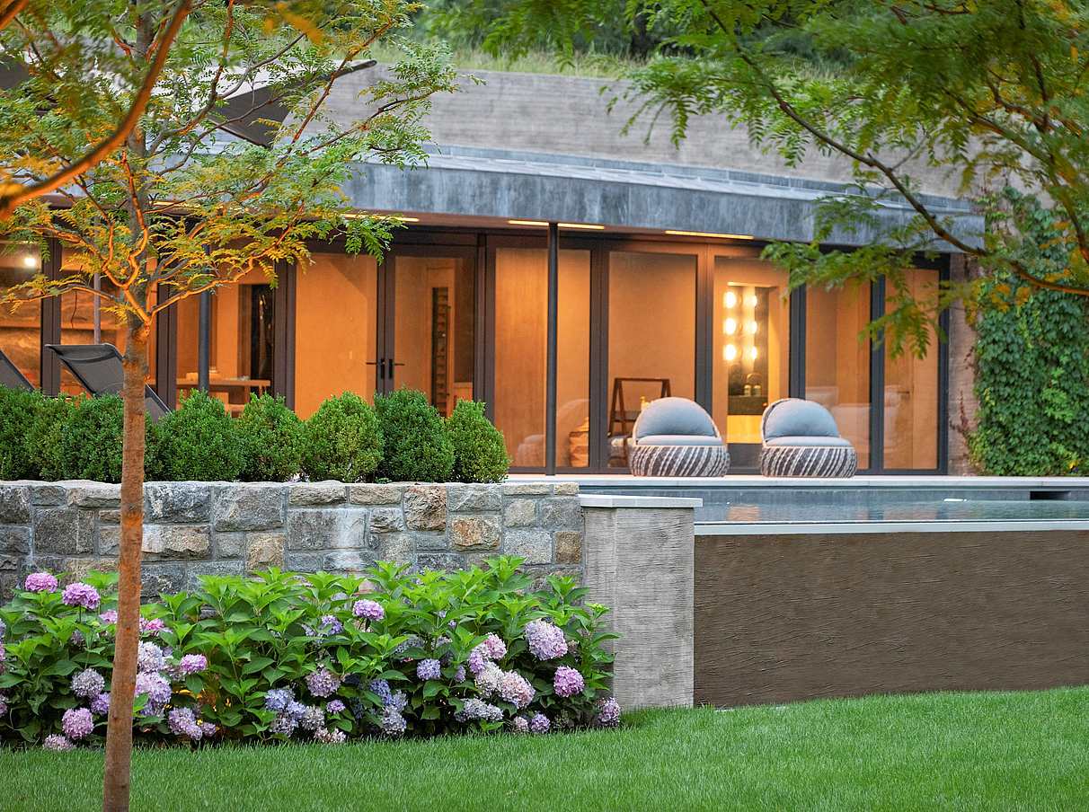pool house design with NanaWall sliding glass doors