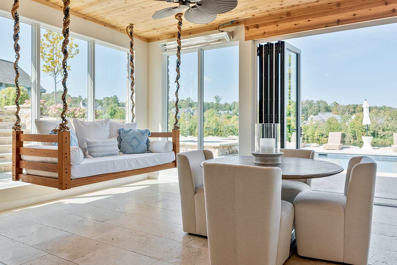 indoor-outdoor pool house design with clad bifold doors