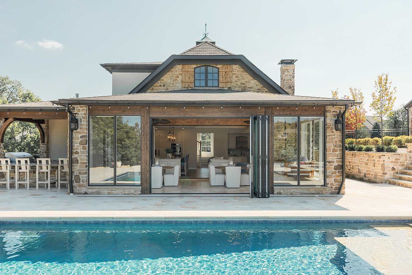 pool house with NanaWall aluminum clad bifold doors