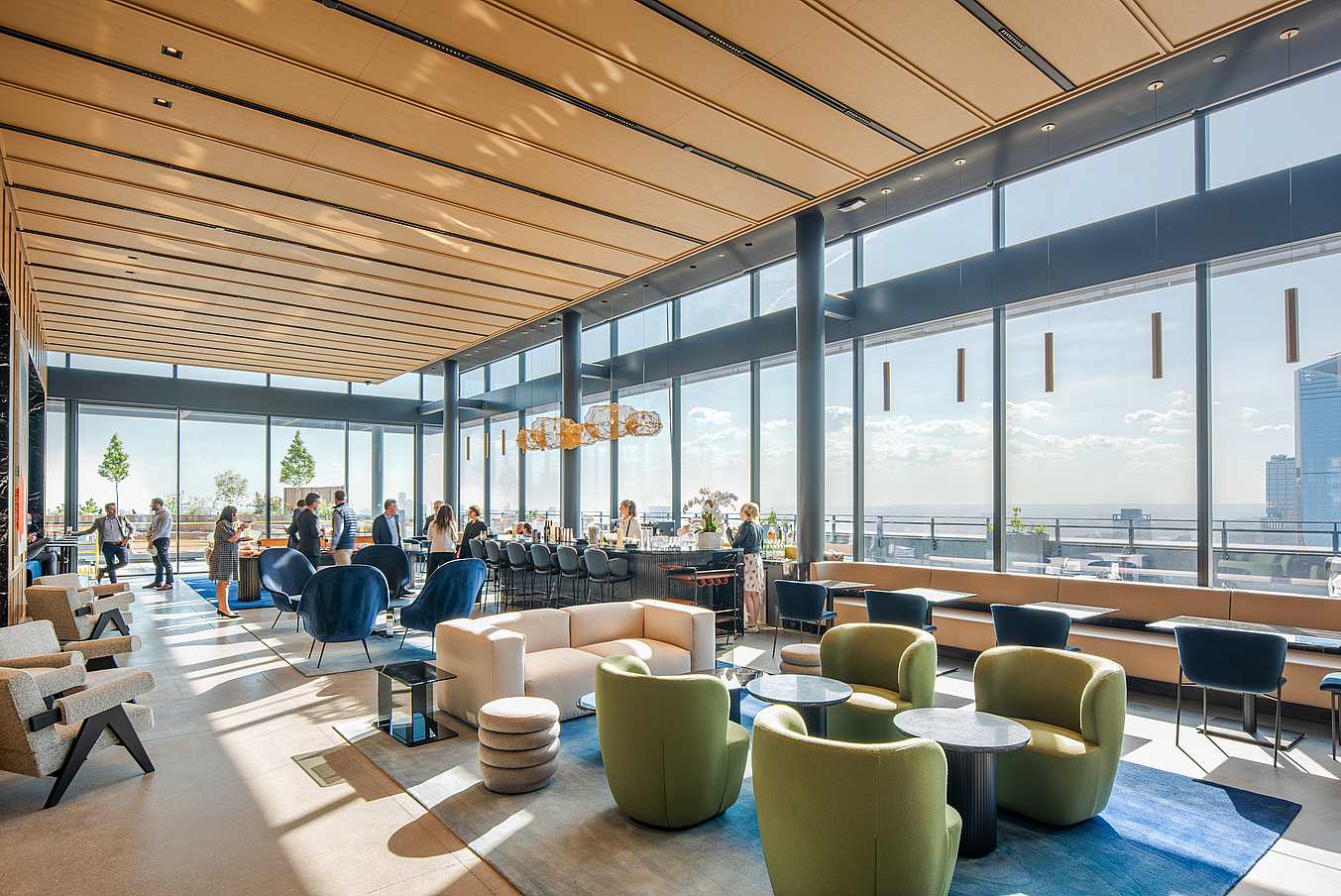Opening glass doors with windload and impact ratings in modern lounge with city views.