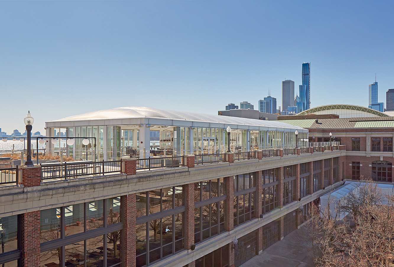 Opening glass doors in modern lounge designed for high weather performance and city views.
