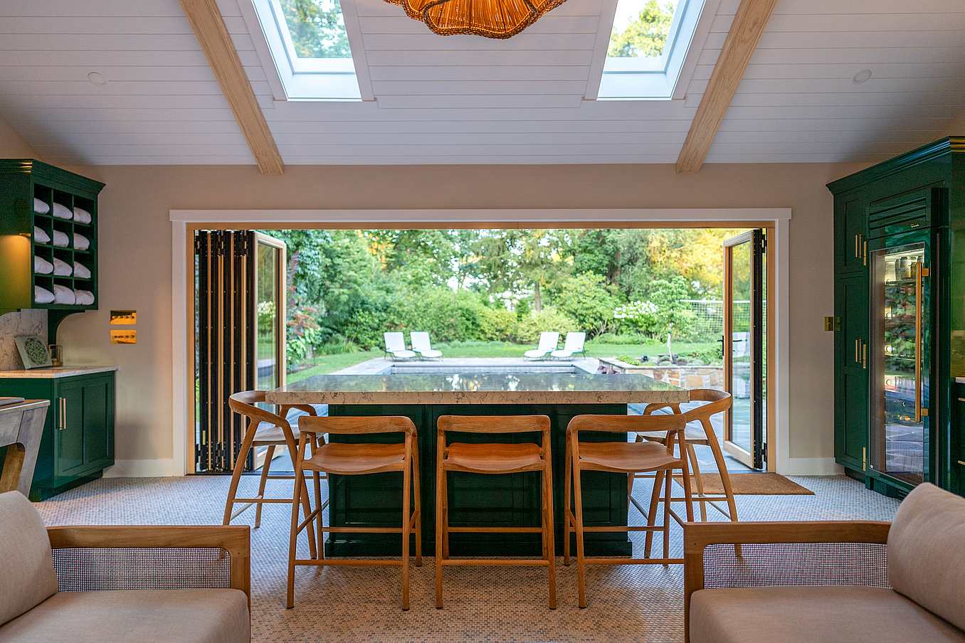 contemporary pool house design with wood bifold doors