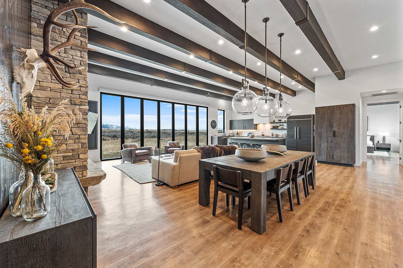 open concept home with large bifold glass wall