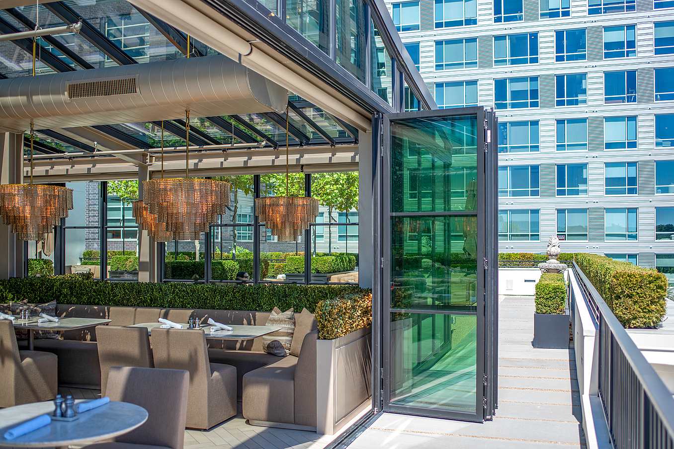 commercial glass door system at RH Raleigh with steel effect
