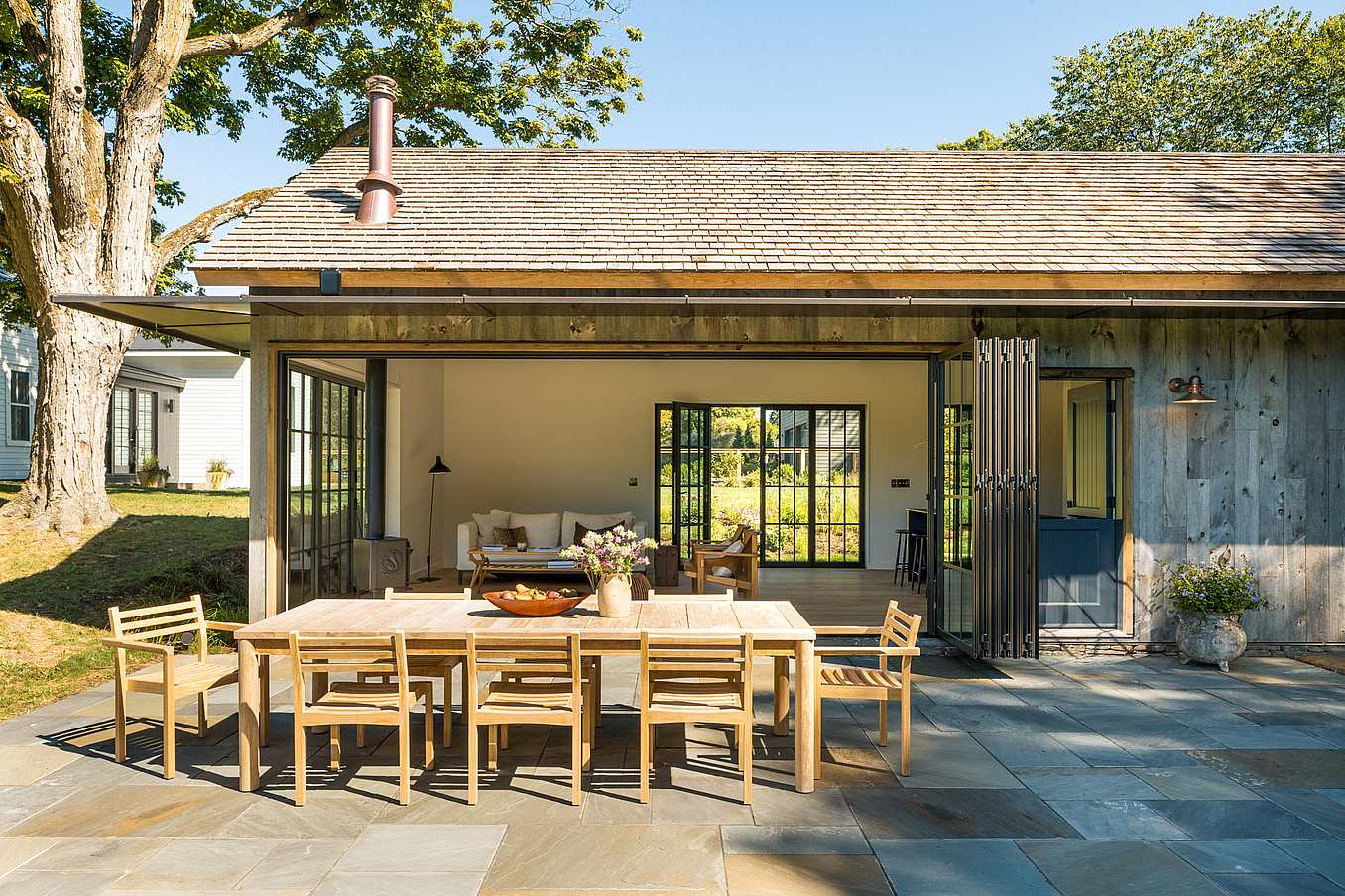 barn-inspired ADU with slimline steel effect folding patio door systems