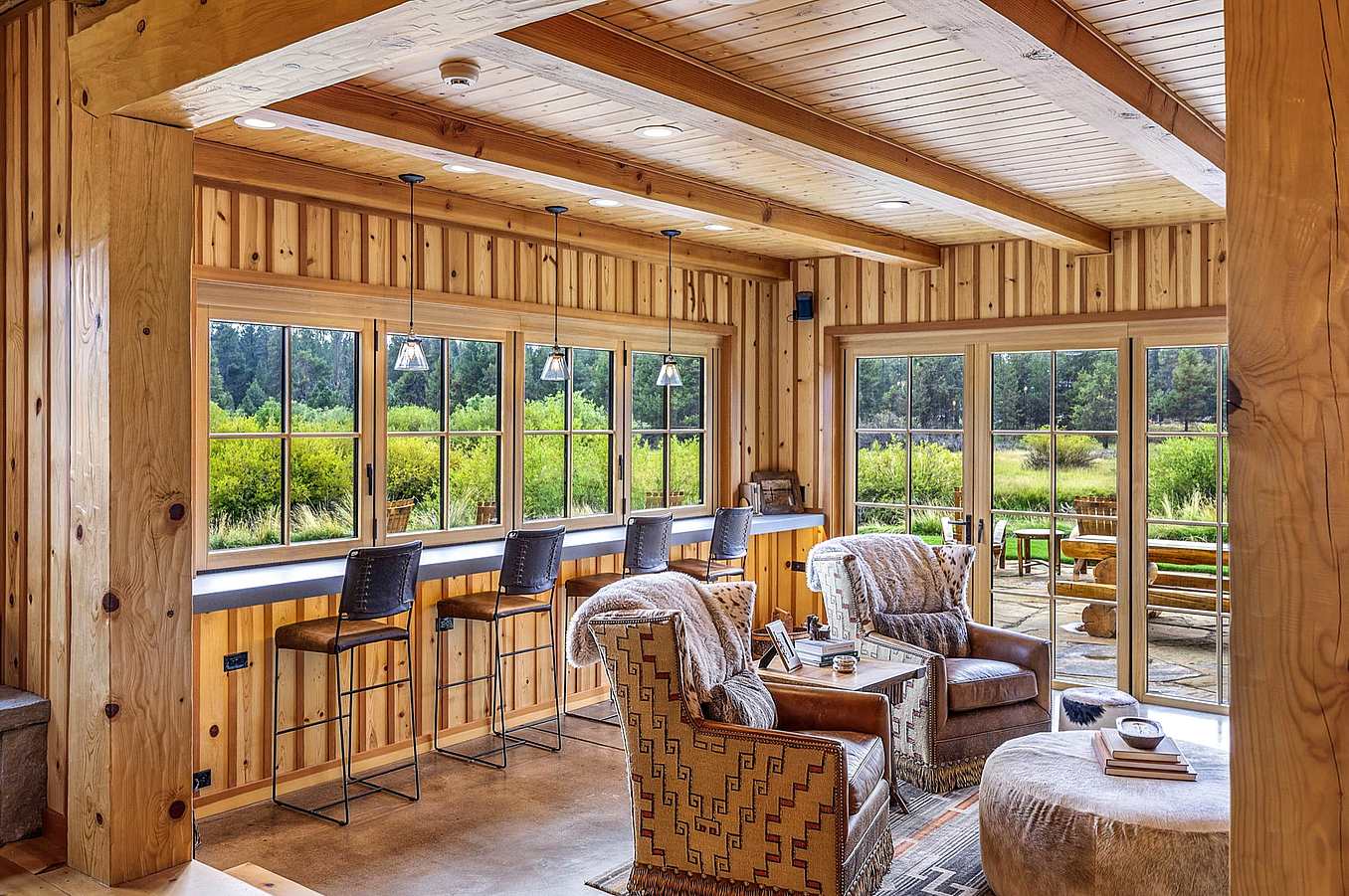 Historic log cabin with clad folding doors and windows