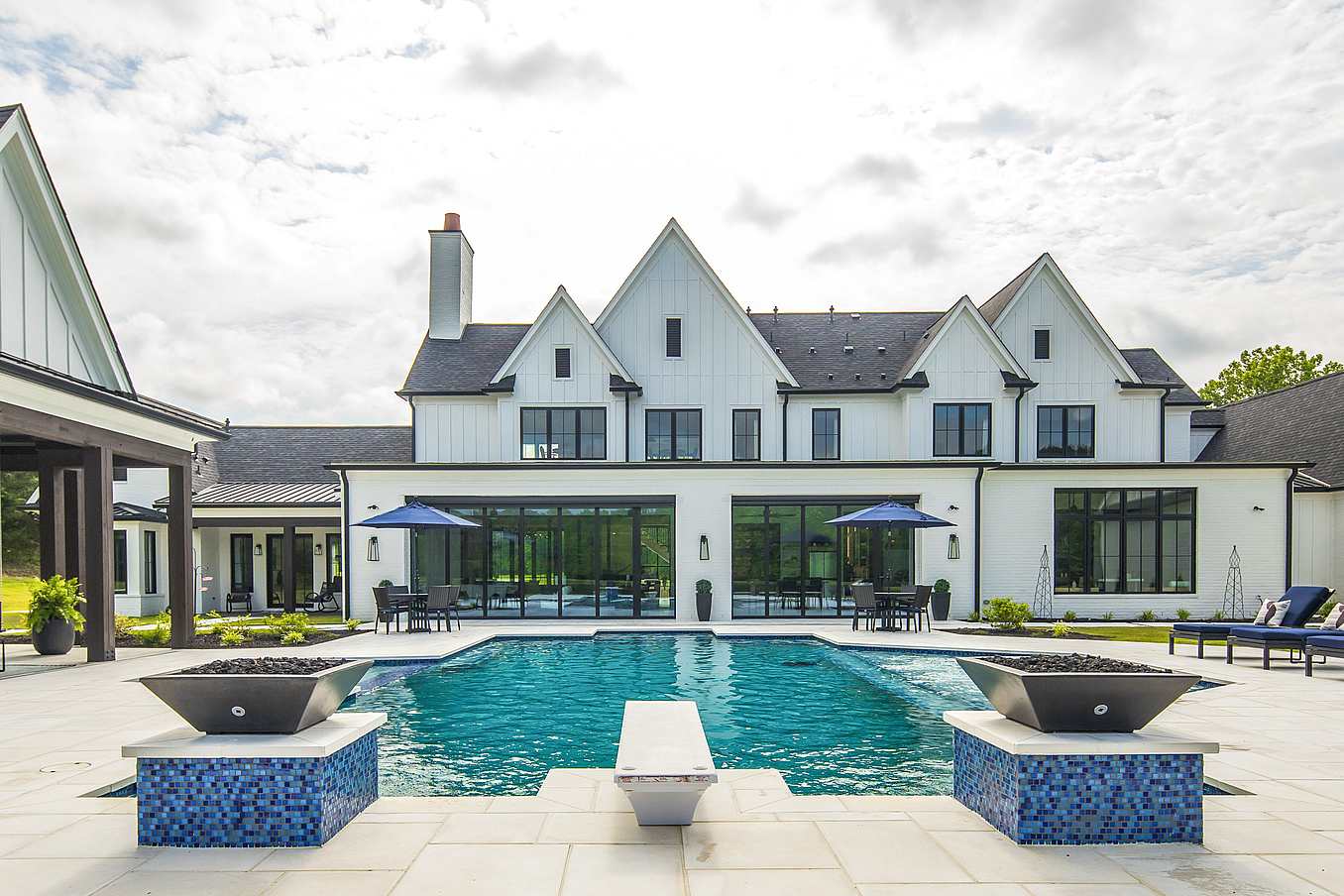indoor-outdoor four-season room with bifold glass doors