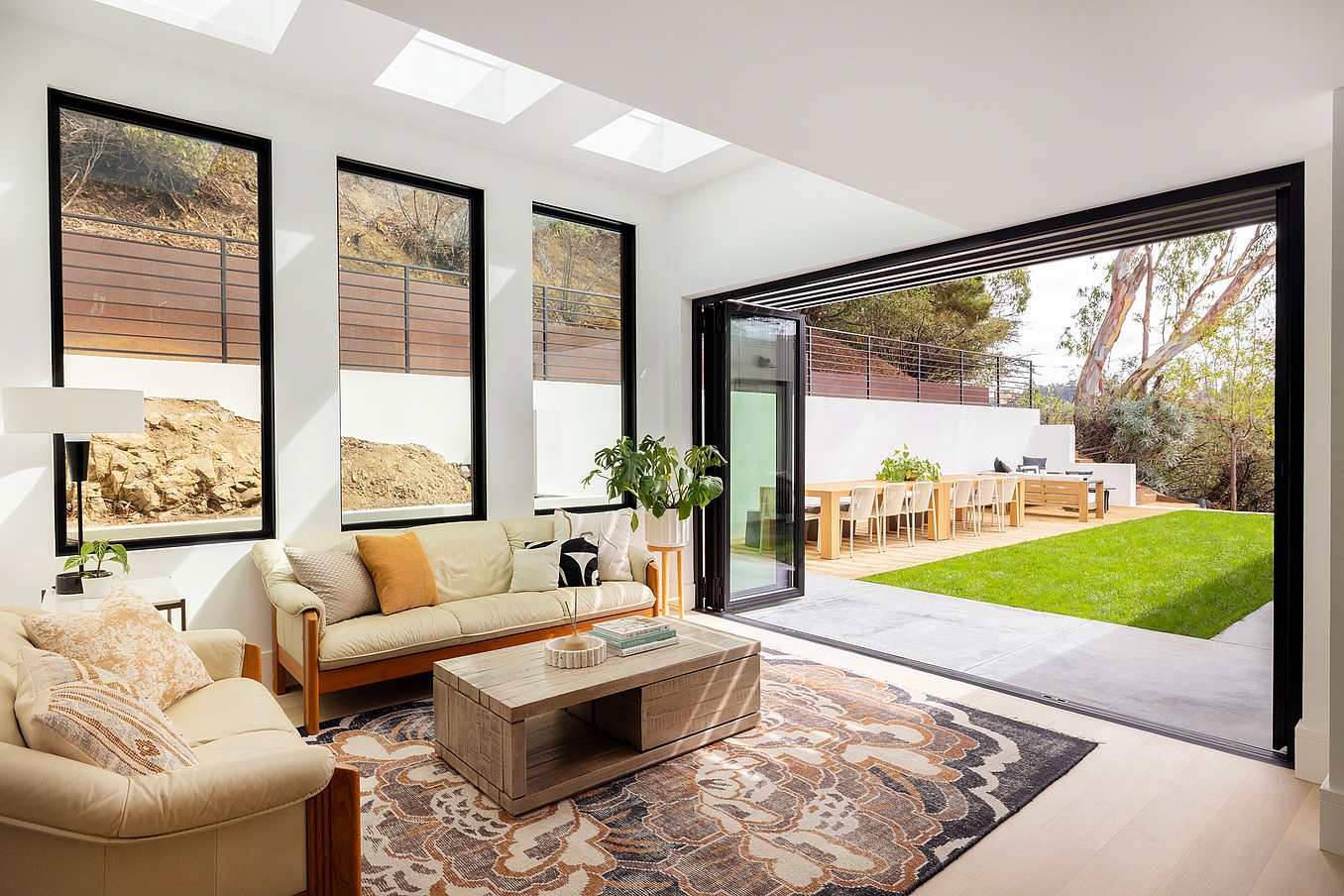 retractable glass wall in modern home remodel