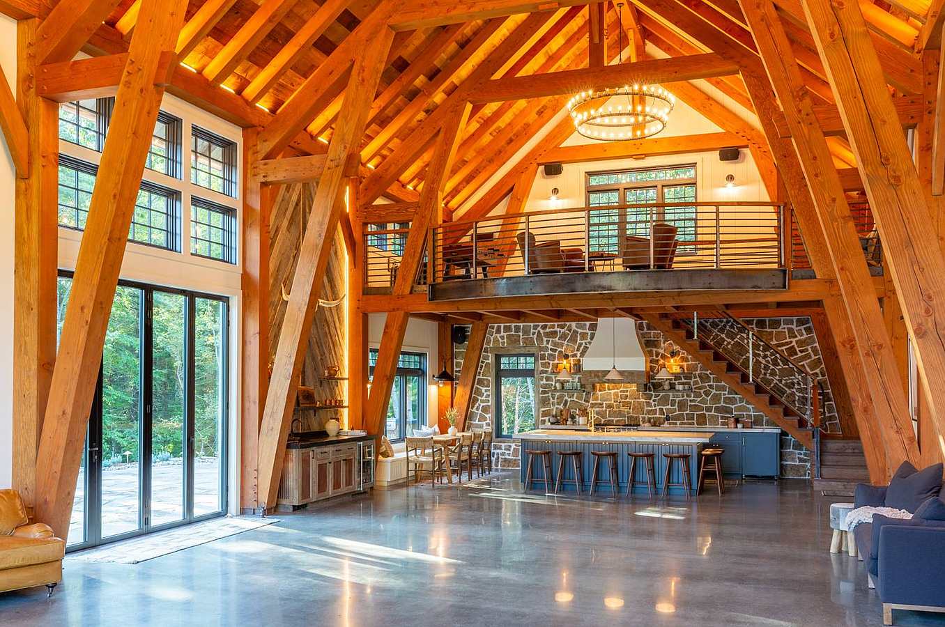 folding glass wall systems in multifunctional barn-like dwelling