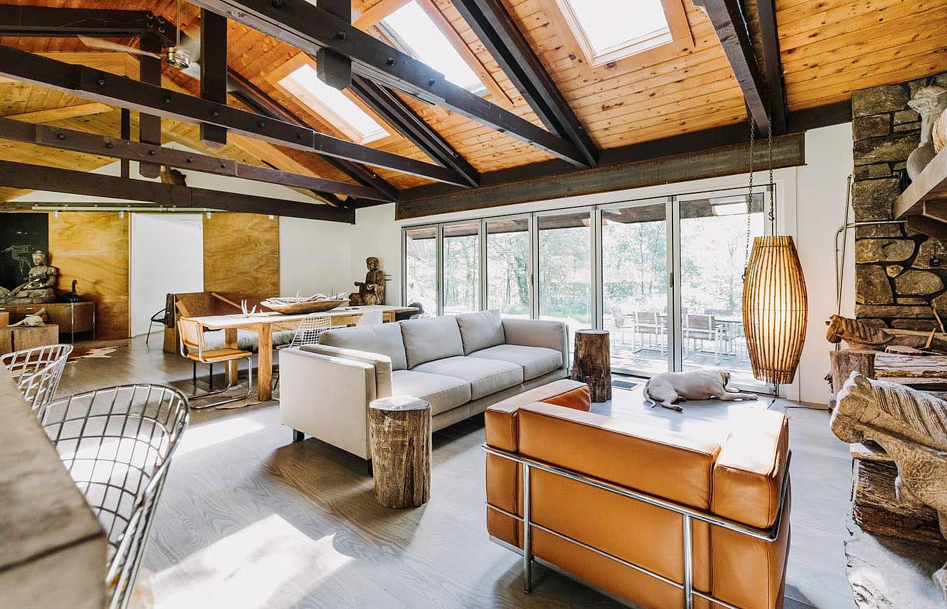 living room remodeled with vaulted ceiling and aluminum framed folding glass wall