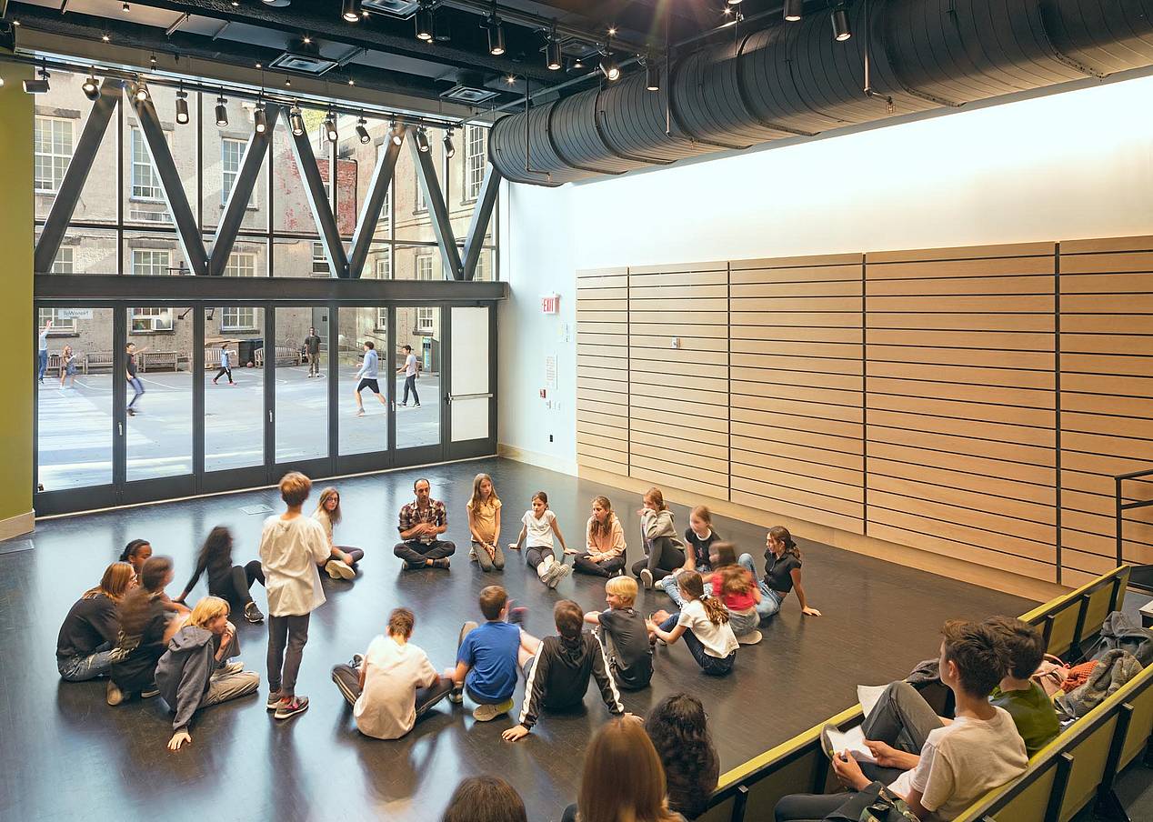 Friends Seminary great room with students in front of bifolding glass door