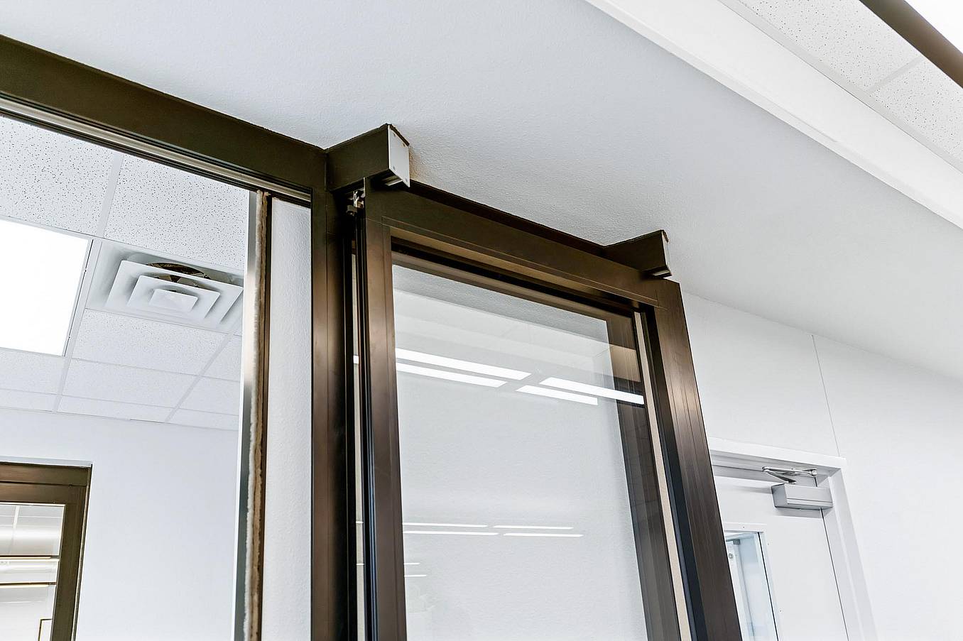 NanaWall HSW stacking glass doors park remotely in learning hub design