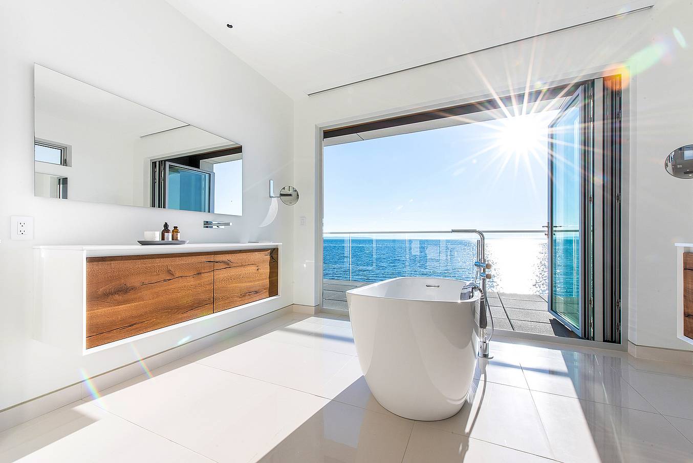 retractable glass walls create bathroom oasis