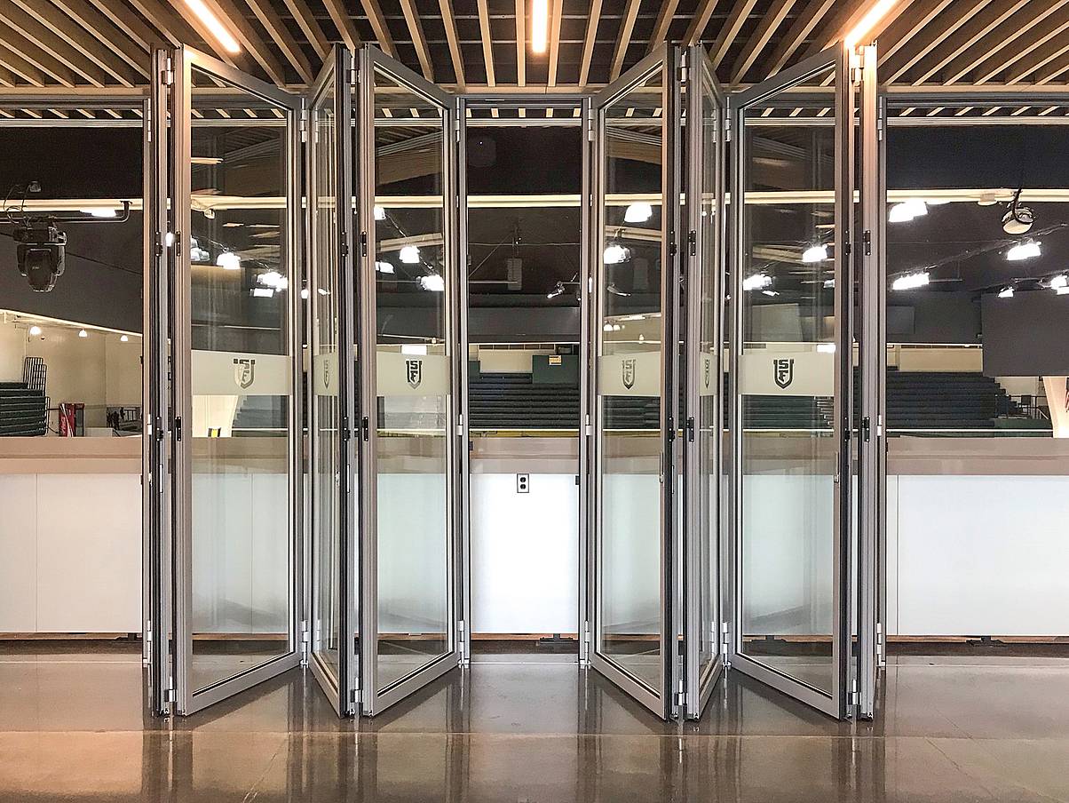 NanaWall FourFold panel sets in acoustic glass wall