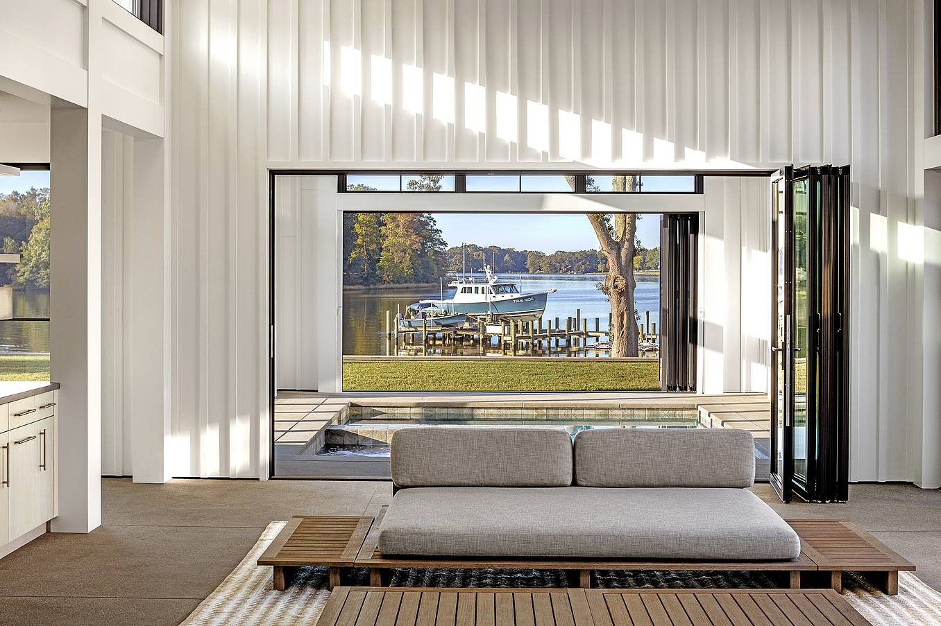 indoor outdoor pool with NanaWall aluminum framed folding doors