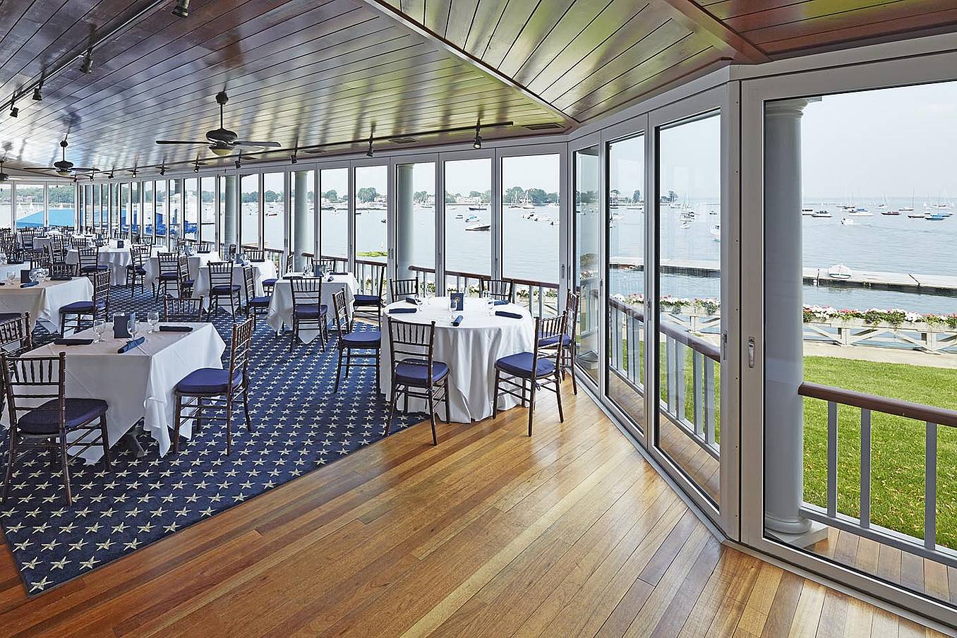 view-of-water-through-opening-glass-walls